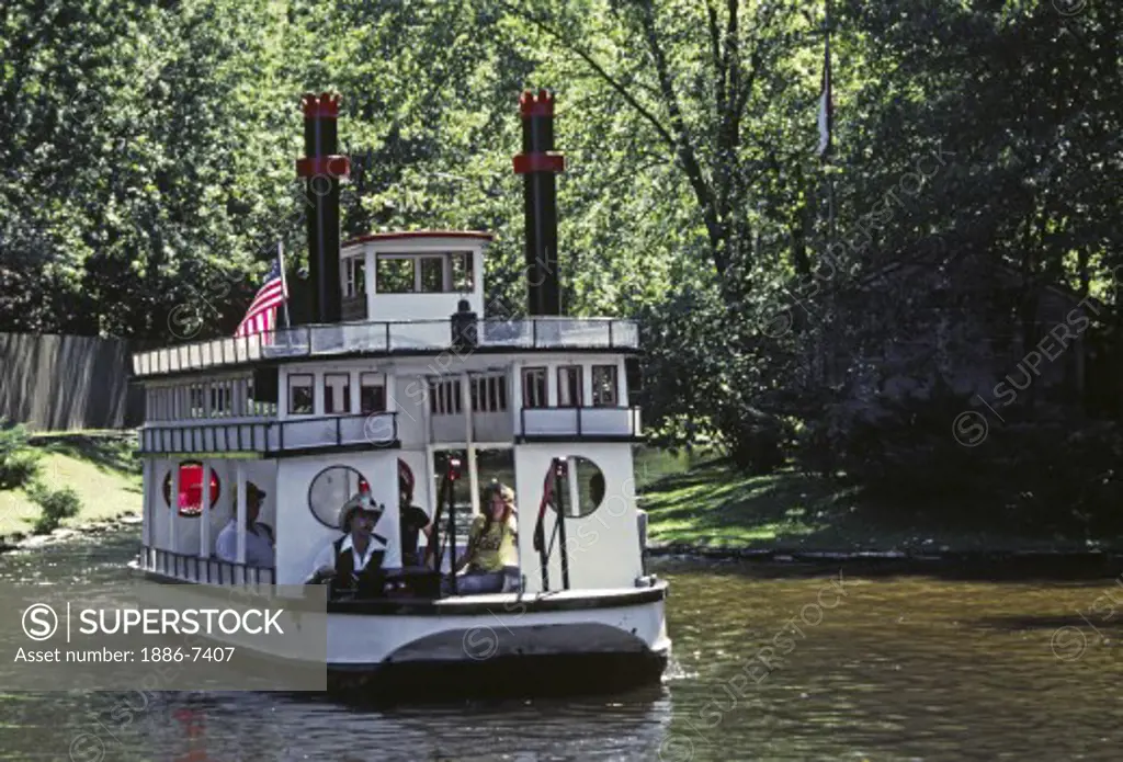 TOUR BOAT in THE WISCONSIN DELLS, an attraction formed by receding water leaving outcroppings of striated rocks - WISCONSIN