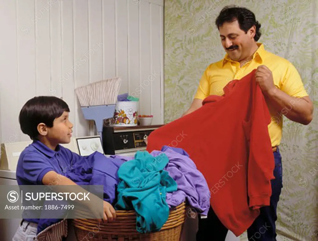 HISPANIC FATHER & SON doing LAUNDRY together