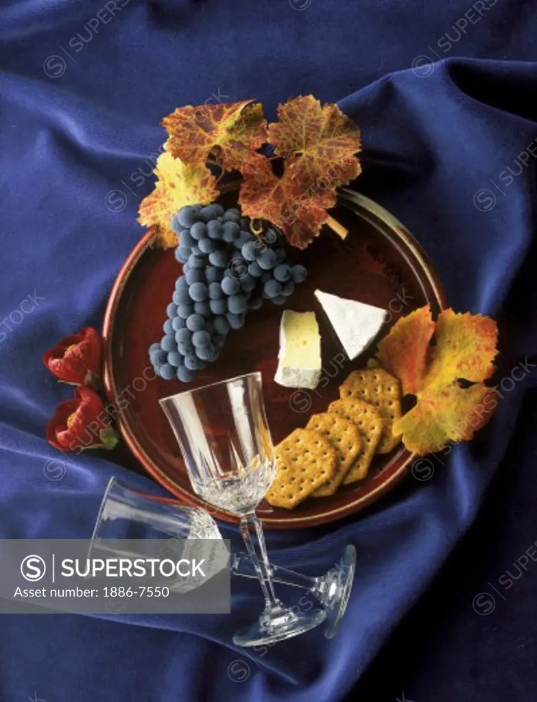 CABERNET WINE GRAPES, CRYSTAL WINE GLASSES, and BRIE on BURGUNDY PLATE and BLUE VELVET - WINE  INDUSTRY 