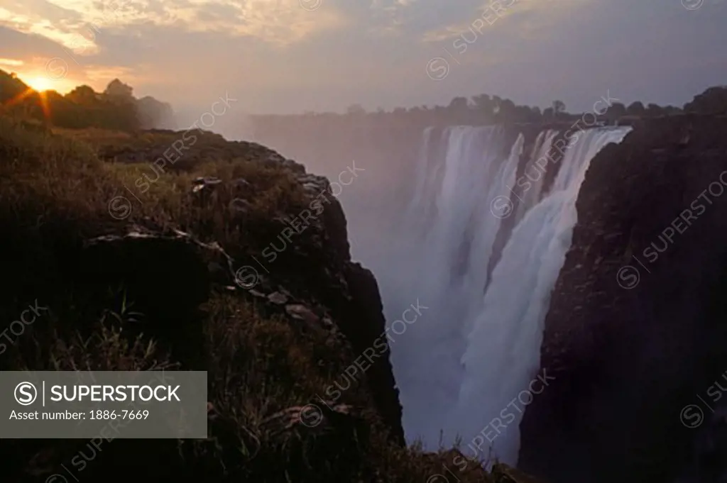 VICTORIA FALLS on the ZAMBEZI RIVER is AFRICA'S most spectacular waterfall & divides ZAMBIA & ZIMBABWE