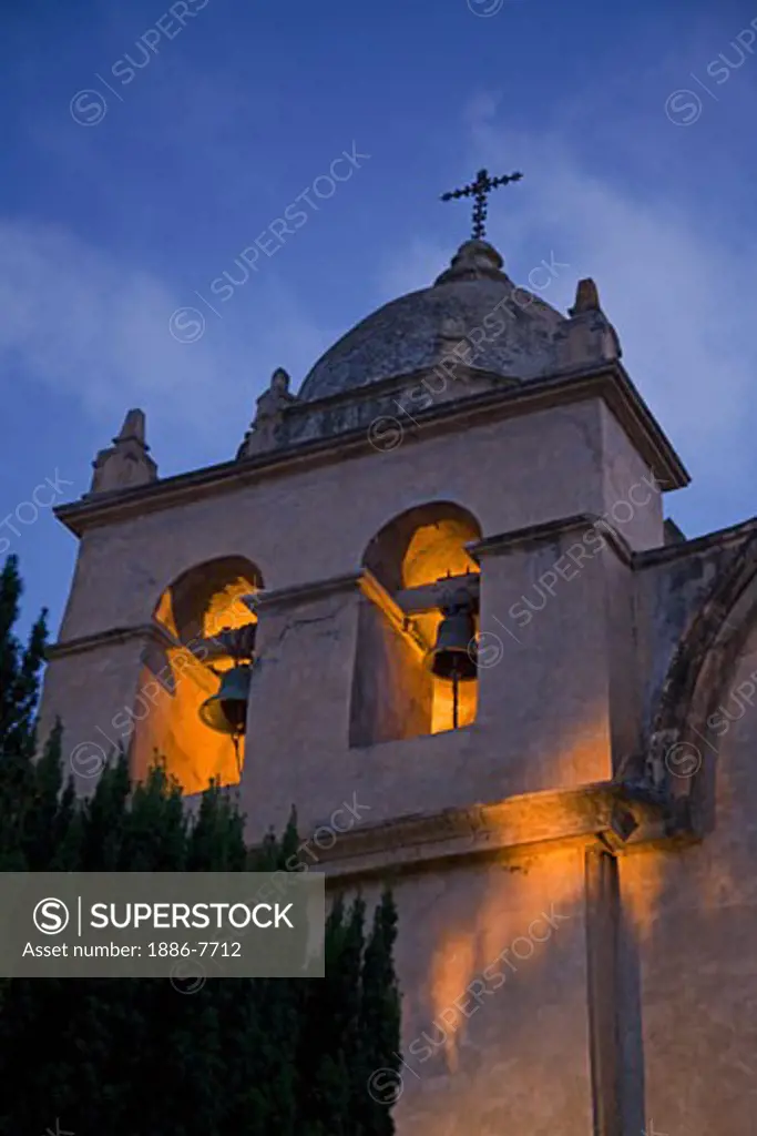 The BELL TOWER of the CARMEL MISSION glows at dusk - CARMEL, CALIFORNIA