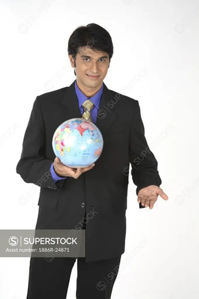 Executive holding globe