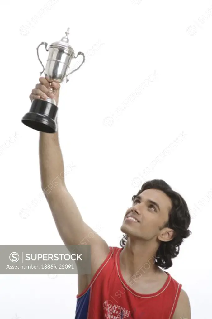 ANG200554 : Teenage boy, posing, winning trophy, cup, success, raising the trophy, MR #  687T