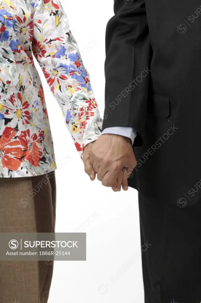 Old couple, senior citizens old man wearing suit, old woman wearing trousers, top with full sleeves and red, blue, yellow gray flowers and leaves, old man holding hand of a old woman, MR # 703B and 703A