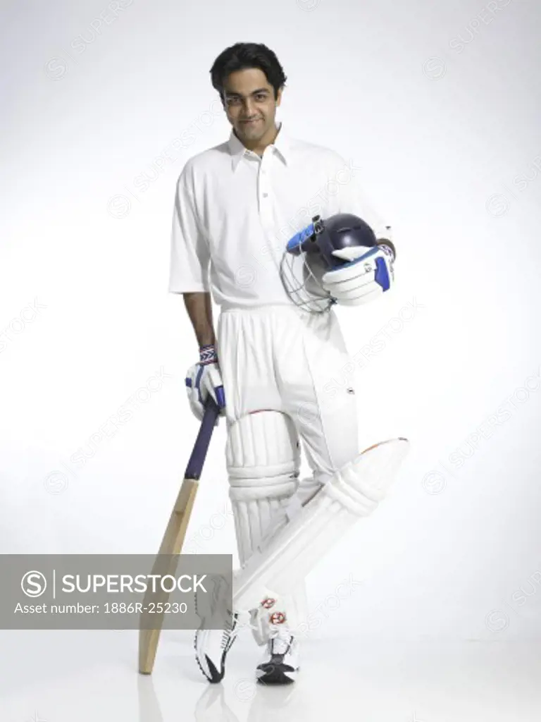 Indian batsman holding helmet and bat ready for cricket match