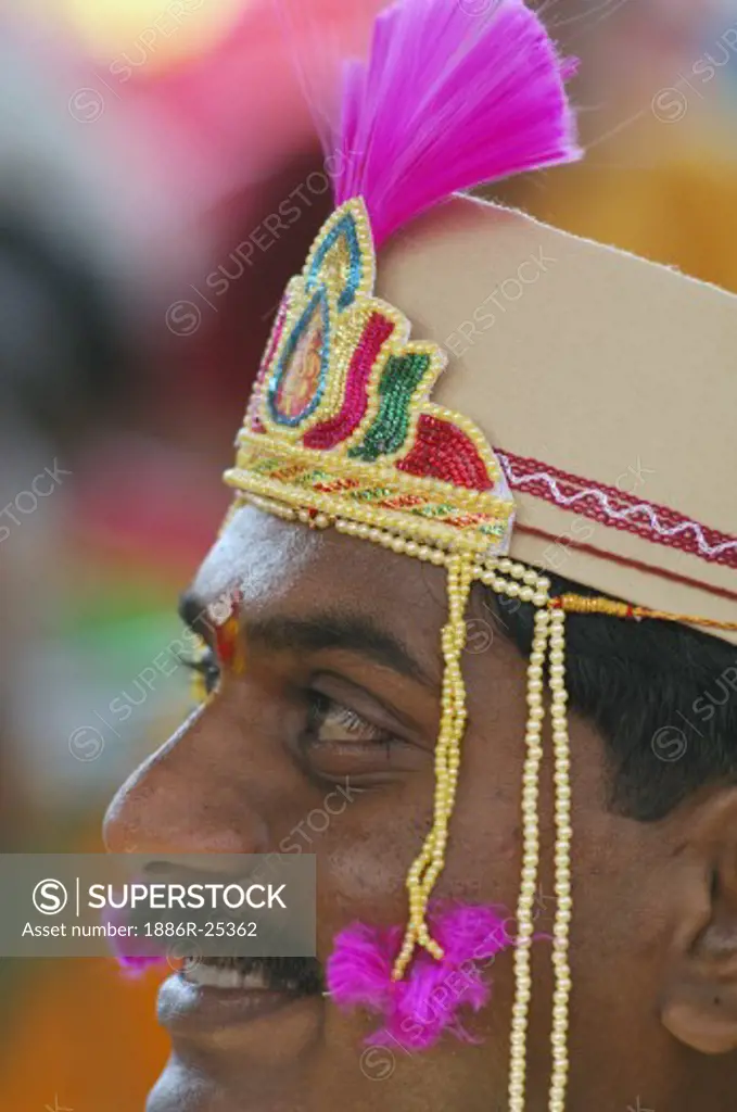Indian Hindu bridegroom wearing traditional cap with mundavalya strings of pearls in marriage ceremony ; Bombay Mumbai ; Maharashtra ; India MR#705U