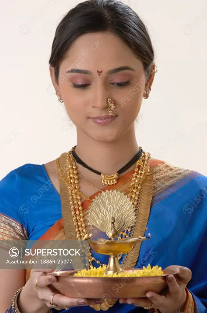 Maharashtrian married woman holding diya plate in hand for occasion MR#716E