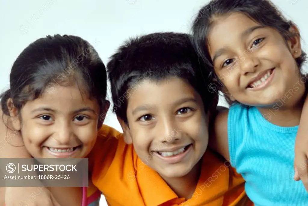Group of South Asian Indian girls with boy smiling together MR#364