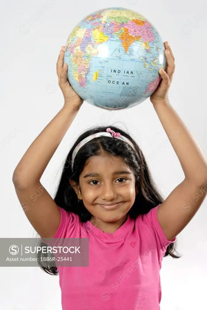South Asian Indian girl holding globe above head and smiling MR#152