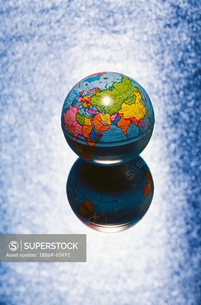Concept ; atlas globe shadow on blue background