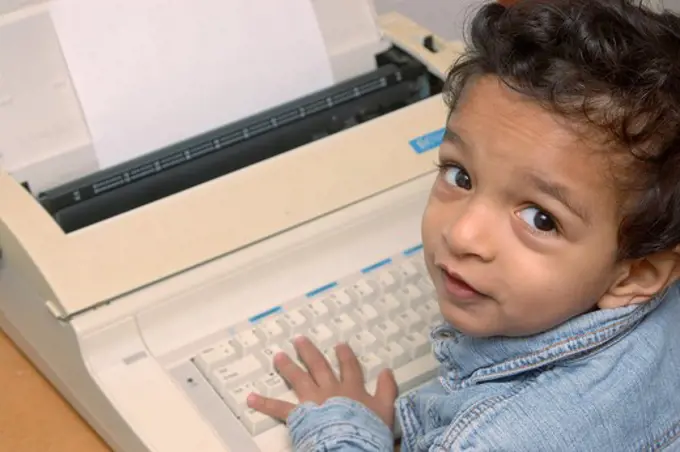 Small boy on electronic typewriter, MR # 468