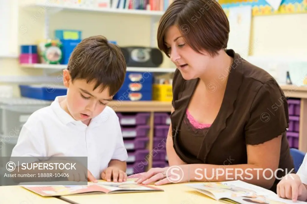 Student in class with teacher reading