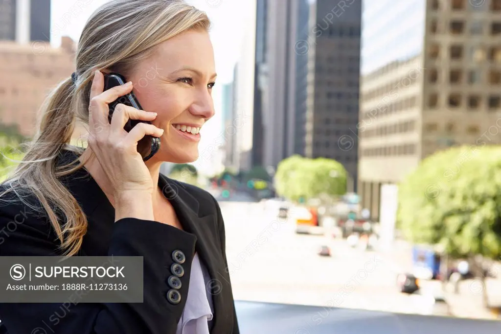 Businesswoman Outside Office On Mobile Phone