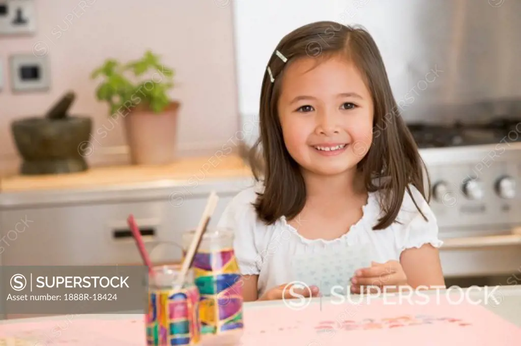 Young Girl Drawing Pictures