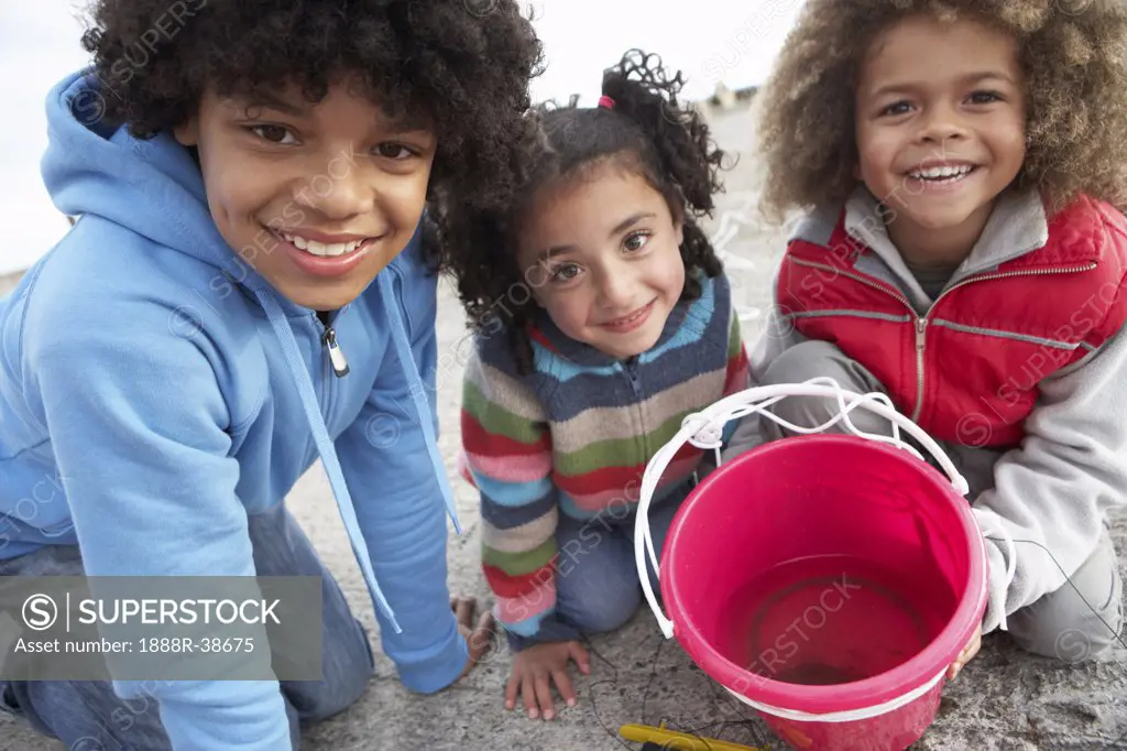 Children fishing for crabs