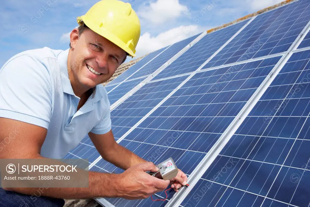 Man installing solar panels