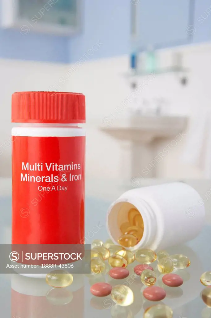 Vitamin pills on bathroom shelf