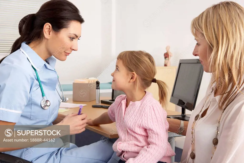 British nurse about to inject young child