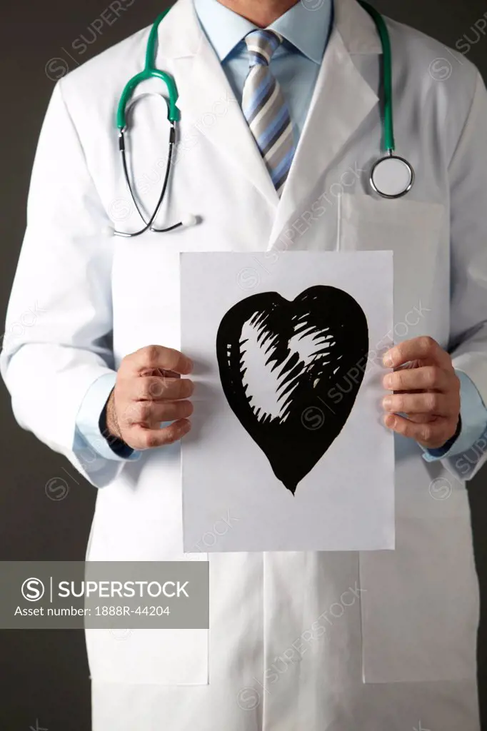American doctor holding ink drawing of heart