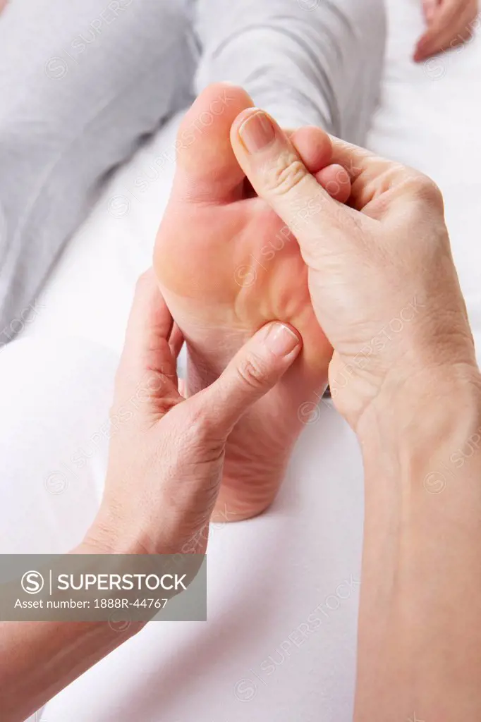 Detail foot reflexology massage