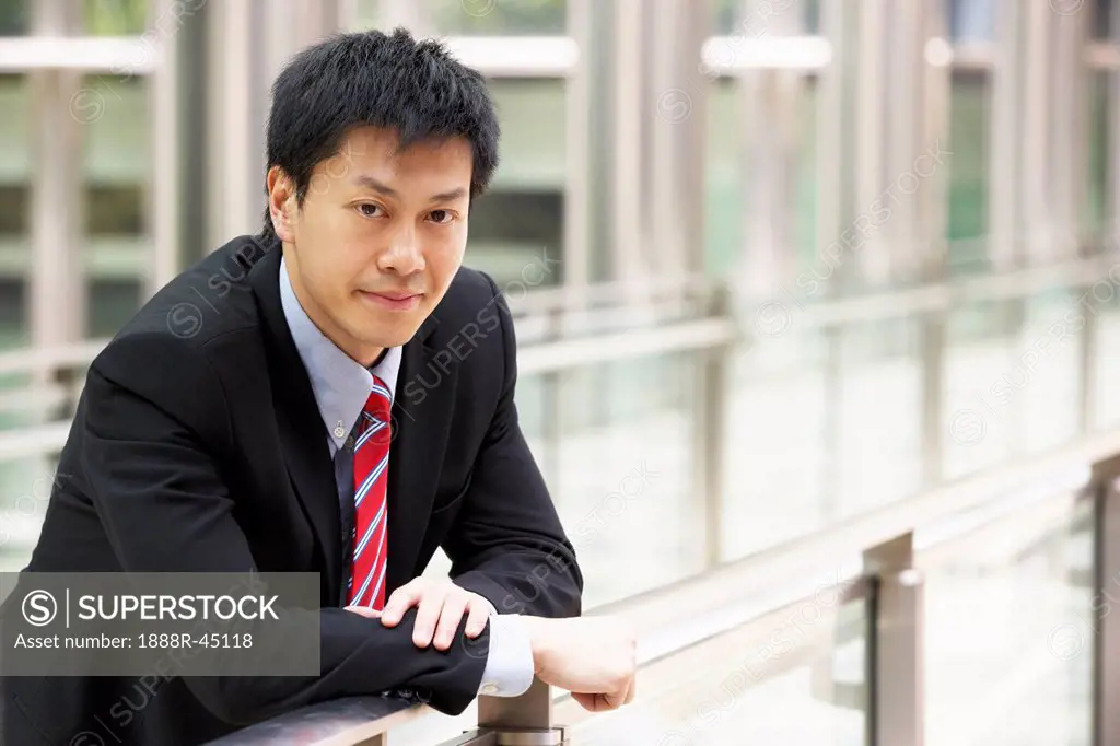 Portrait Of Chinese Businessman Outside Office