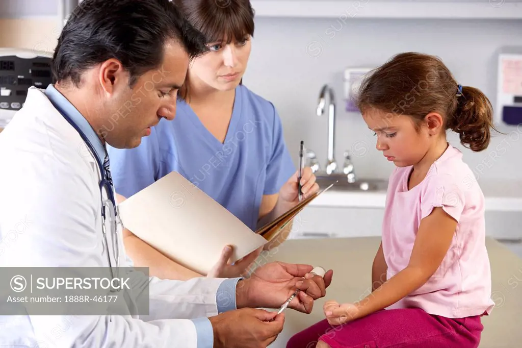 Doctor Giving Child Injection In Doctor´s Office