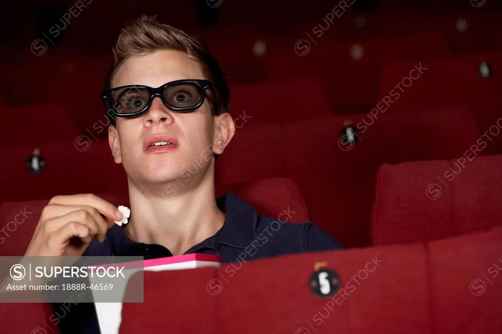 Man Watching 3D Film In Cinema