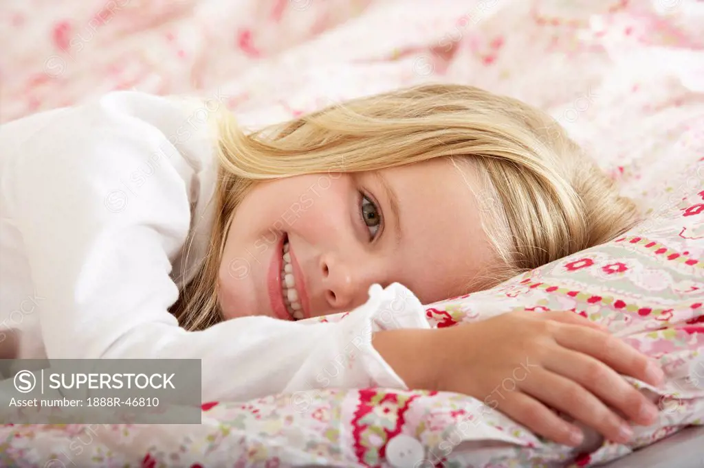 Young Girl Relaxing On Bed