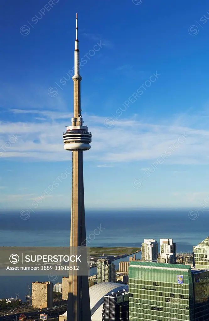 Aerial view of CN tower looking towards downtown Toronto, Island airport and Lake Ontario from First Canadian Place; Toronto, Ontario, Canada