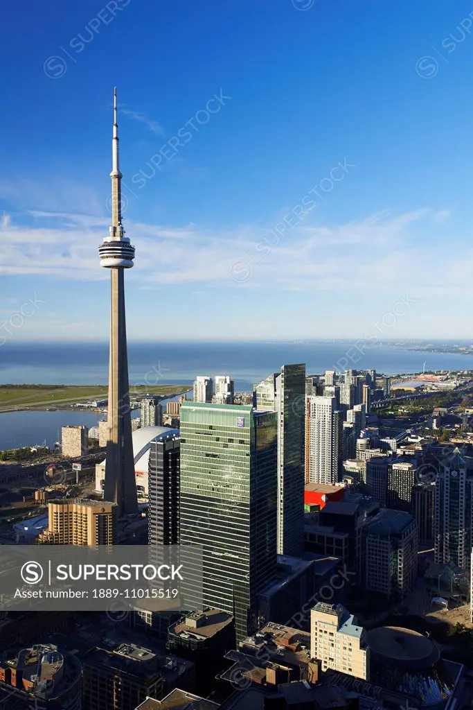 Aerial view of CN tower looking towards downtown Toronto, Island airport and Lake Ontario from First Canadian Place; Toronto, Ontario, Canada