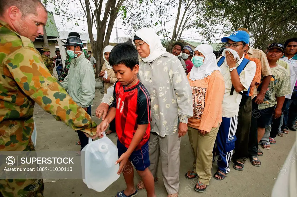 Australian armed forces brought a large water purification plant to supply clean drinking water after the Indian Ocean tsunami in 2004; Aceh Province,...