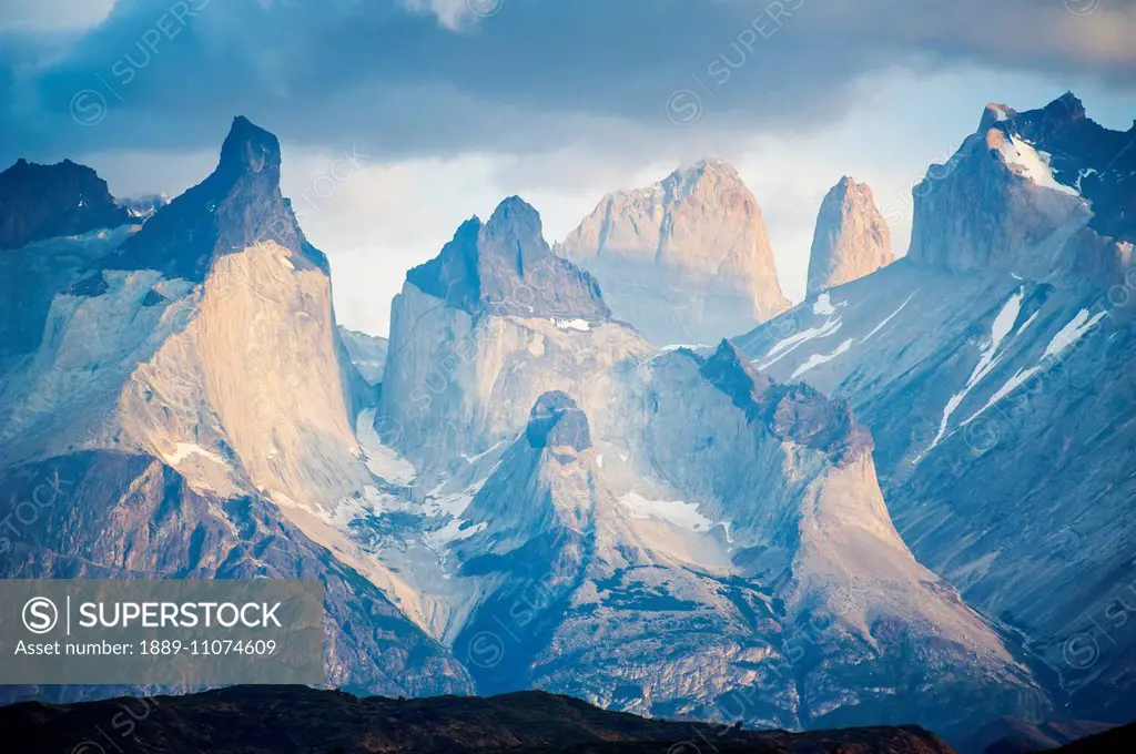 Mountain range in the distance in Torres del Paine National Park; Torres del Paine, Mallaganes, Chile