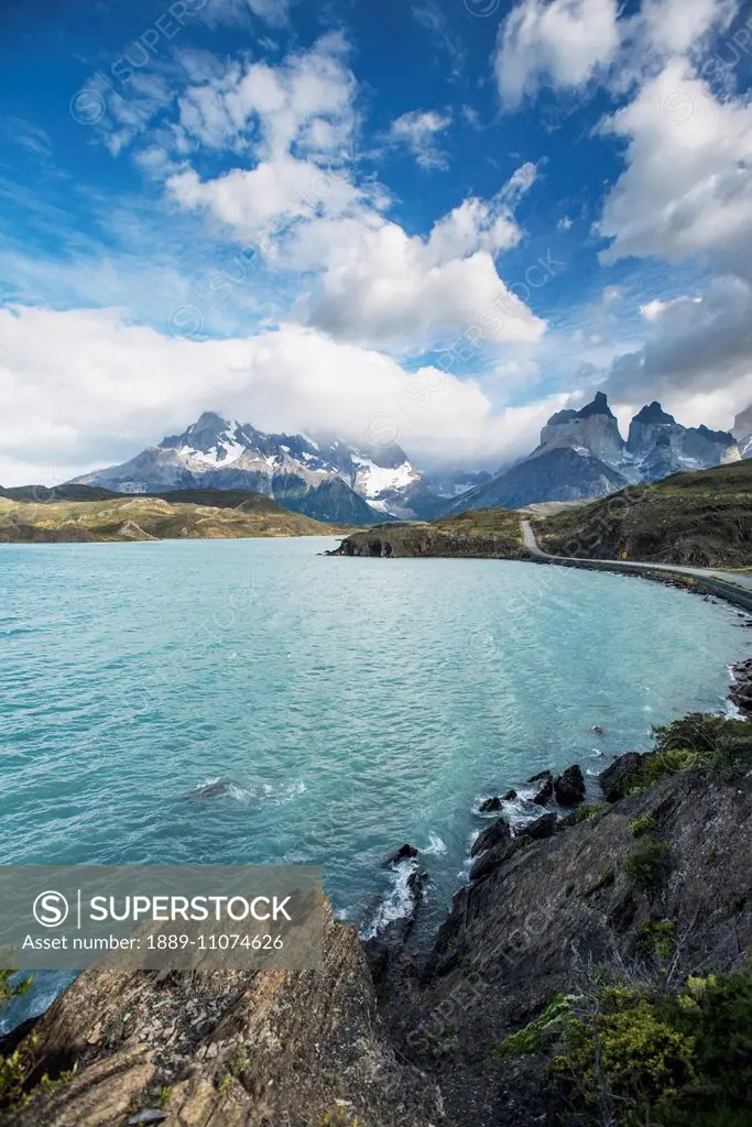 Waterway and mountain ranges in Torres del Paine National Park; Torres del Paine, Magallanes, Chile