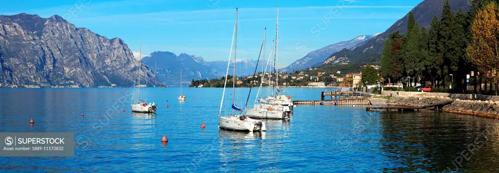 Boats moored in a harbour of Lake Garda; Malcesine, Verona, Italy