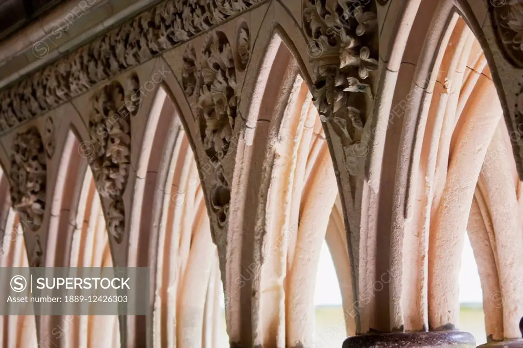 Arches Between The Double Columns Of The Cloister Of The Abbey Of Mont-Saint-Michel, France