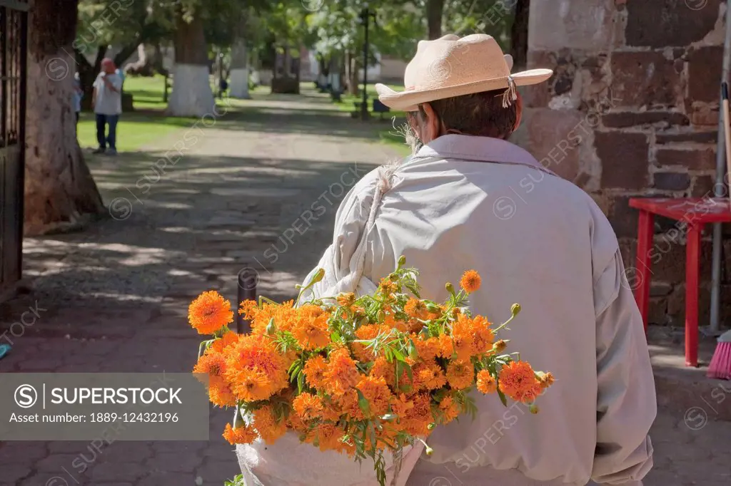 Man Carrying A Marigolds For The Celebration Of D