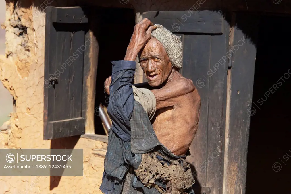 Old Man In A Merina Village Along The Road Between Ambositra & Ambavalao, Fianarantsoa Province, Madagascar