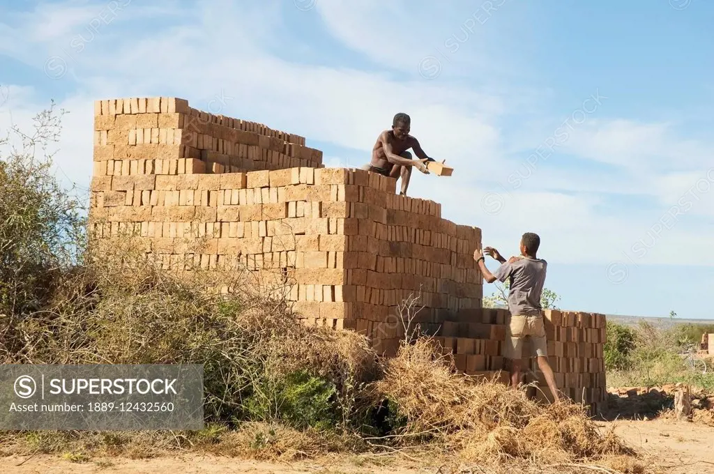 Men Piling Bricks For Firing In Antsokay, Toliara Province, Madagascar