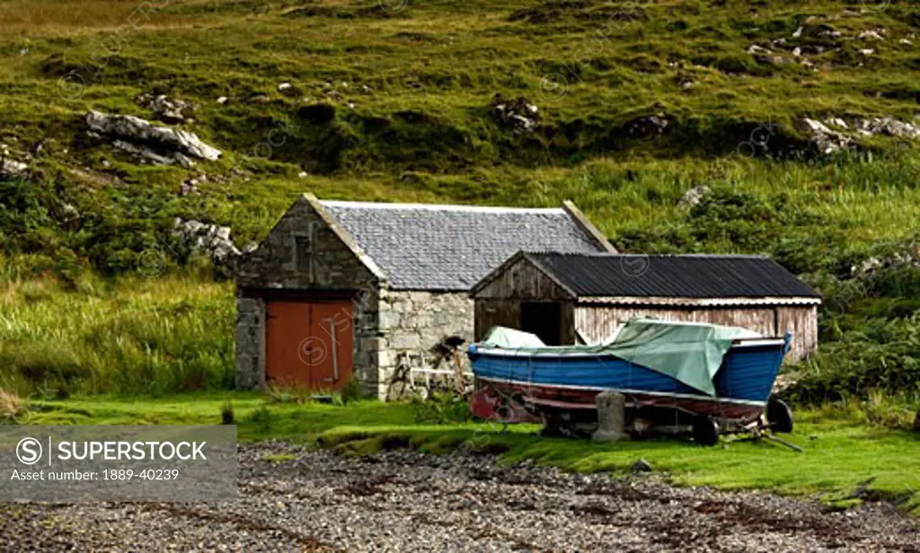 Scotland; Boat docked by boathouse