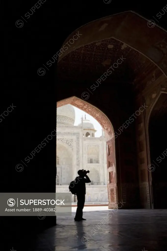 Tourist with camera in Taj Mahal; Taj Mahal, Agra, India