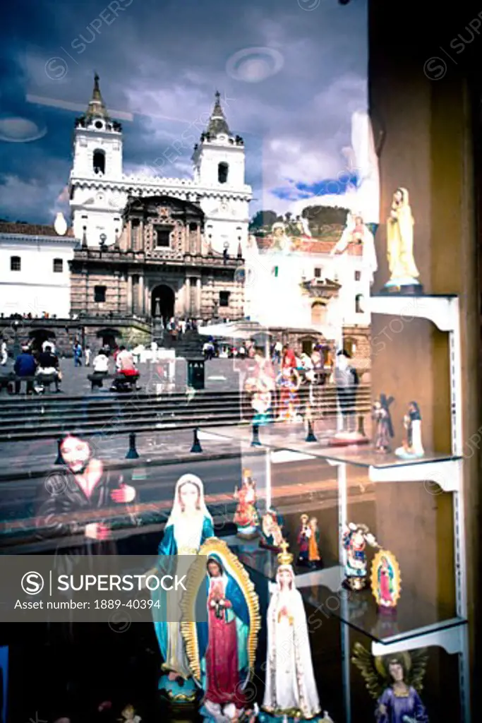 Window display of shop selling devotional articles; Quito, Ecuador