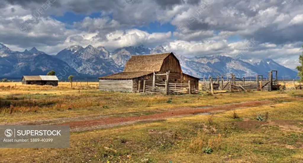 Remote landscape with mountains in background; Mormon Row Historic District, Grand Teton National Park, Teton Range, Wyoming, USA