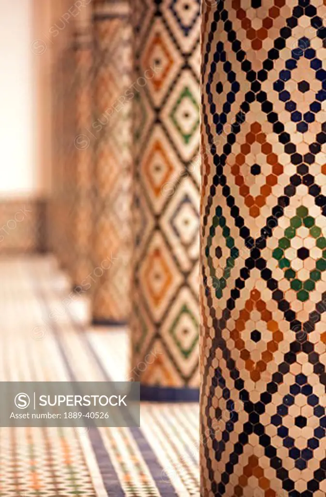 Mosaic tiled pillars inside Mnebhi Palace; Marrakech, Morocco
