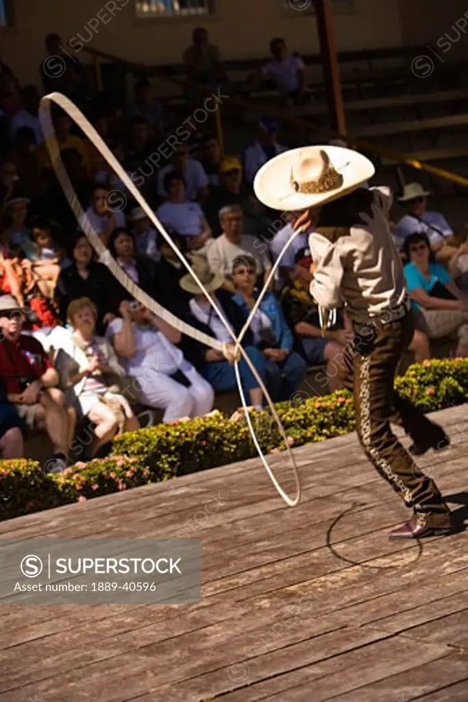 14 year old Hispanic Charrito (cowboy) from Mazatlan performing in Aztec Theater folkloric Show,; Golden Zone, Mazatlan, Sinaloa State, Mexico