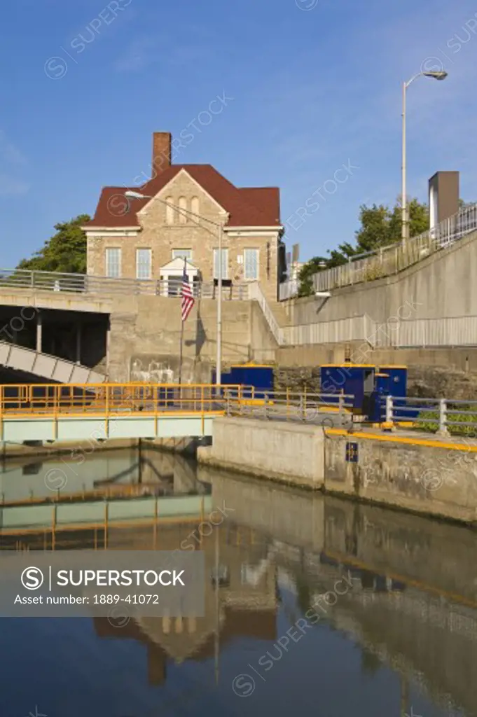 Tranquil scene of Erie Canal Locks and Old City Hall; Lockport, New York, USA
