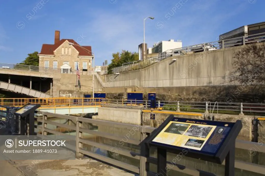 Tranquil scene on Erie Canal Locks and Old City Hall; Lockport, New York, USA