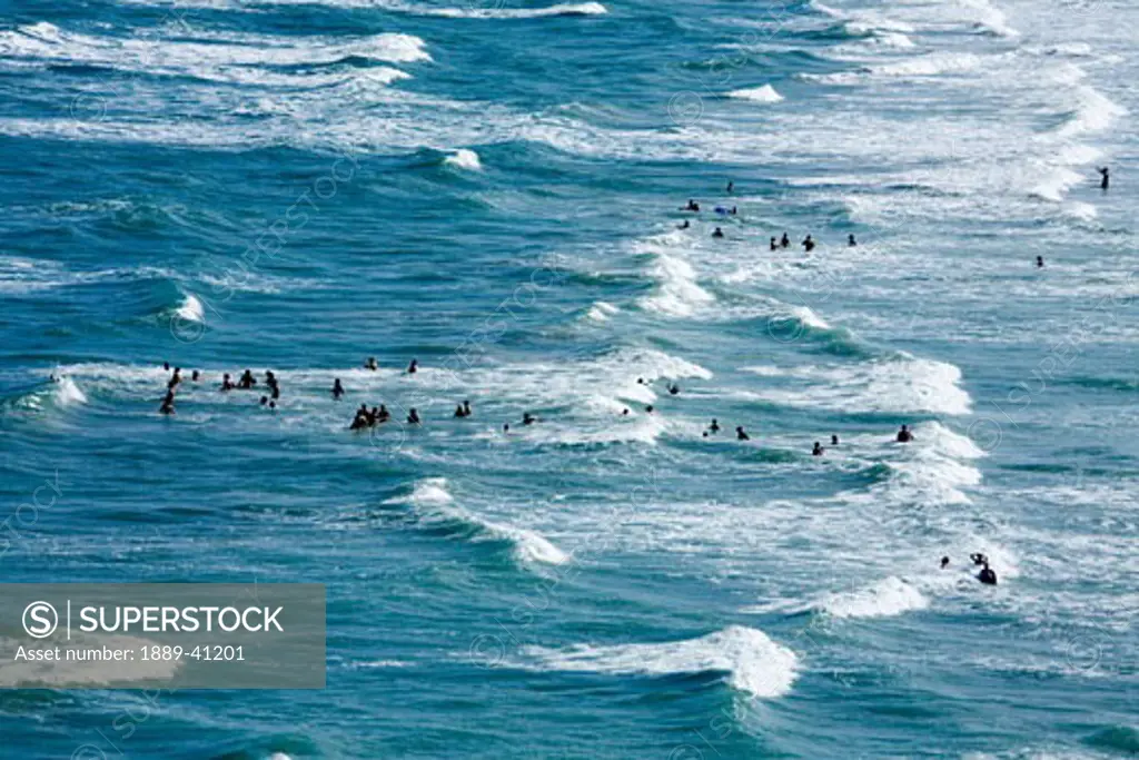 High angle view of people swimming in sea; Cocoa Beach, Florida, USA
