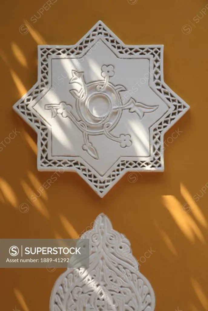 Islamic detail on the ochre walls of the Islamic Arts museum in the Majorelle Gardens; Marrakech, Marrakech, Morocco