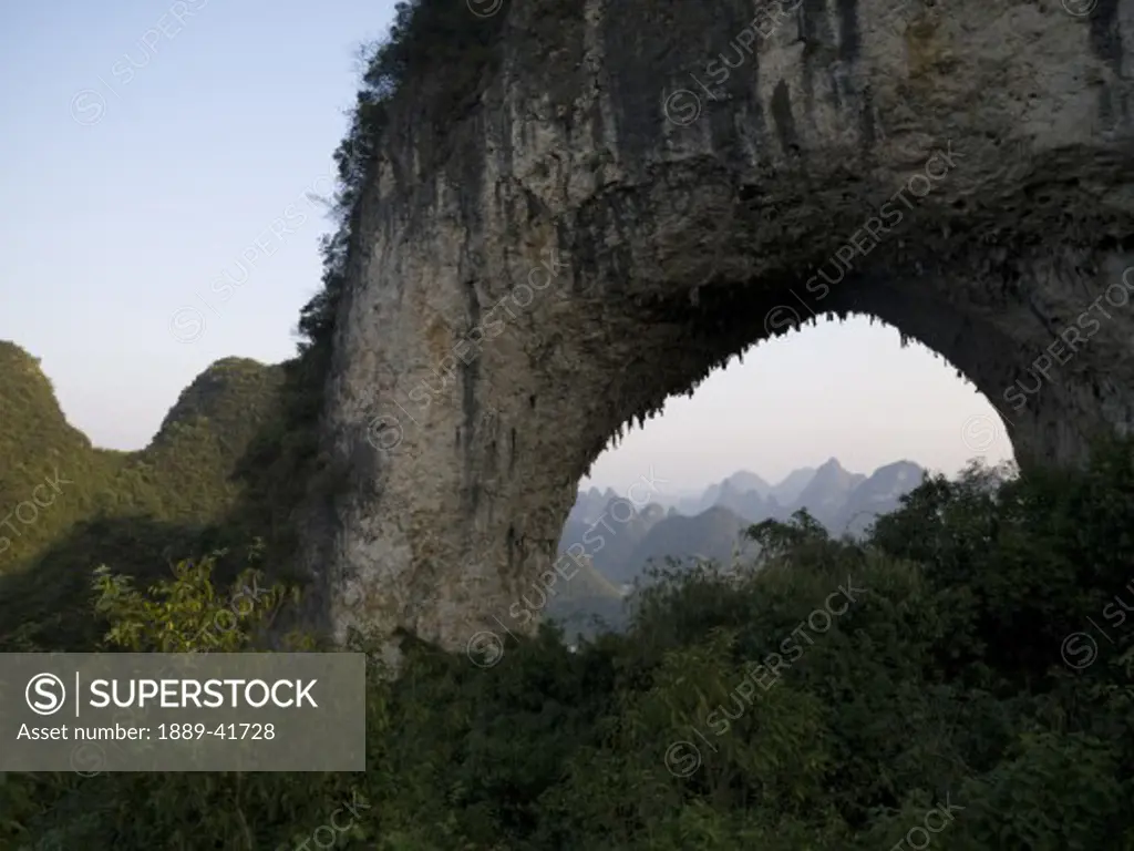 Natural arch in mountains; 