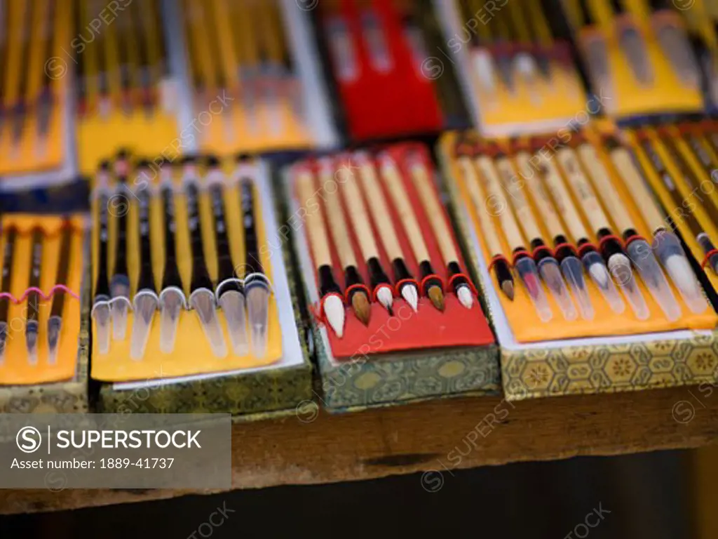 Various pencils for sale on market stall; 